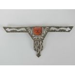 An unusual Art Deco white metal applique jewel encrusted with marcasites and having central