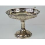 A HM silver tazza with pierced gallery and single foot, hallmarked Birmingham 1930, 13.32ozt.