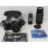 A Canon AE-1 35mm SLR with original case and instructions, together with a Voigtlander VC21B flash,