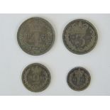 A cased full set of Victorian 'Young Head' Maundy Money dated 1877 and comprising 4p, 3p,