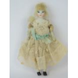 A late Victorian miniature porcelain doll,