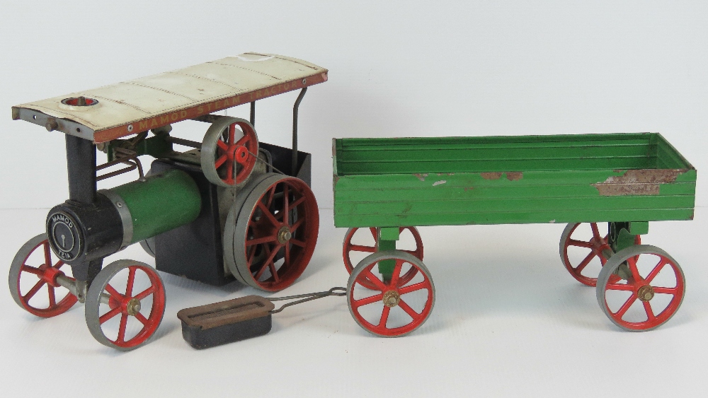 A Mamod scale model live steam traction engine, complete with single piston, spring-belt drive,