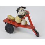 A vintage miniature Disney Mickey Mouse felt figurine with clockwork tricycle (one rear wheel