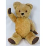 A vintage jointed mohair teddy bear, 56cm high.