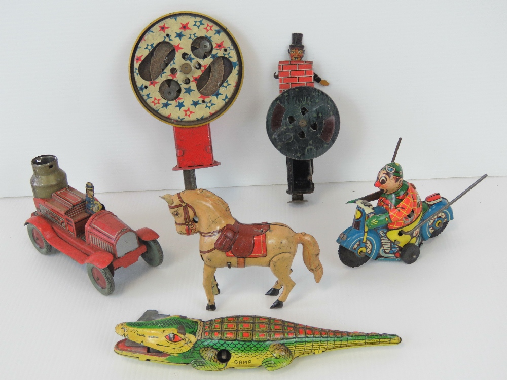 A small quantity of mid-20th century tin plate toys including; fire engine, alligator, motorbike,