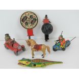 A small quantity of mid-20th century tin plate toys including; fire engine, alligator, motorbike,