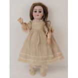 A German bisque head doll by Simon & Halbig, with grey glass sleep eyes,