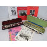 A contemporary Yamaha flute within hard case,