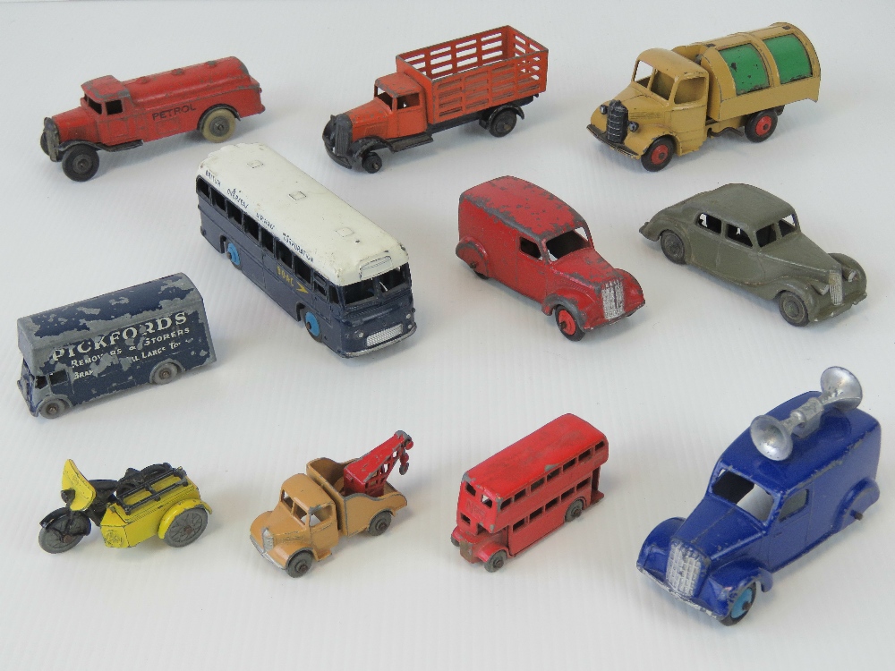 A quantity of unboxed and played with Dinky toys including; Bedford Refuse Truck, BOAC Coach,