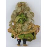 An early 20thC miniature bisque head doll,