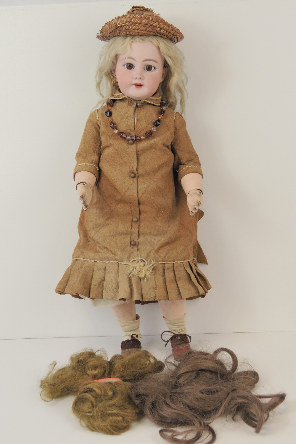 A early 20thC bisque head doll probably by Simon & Halbig,