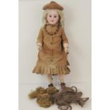 A early 20thC bisque head doll probably by Simon & Halbig,