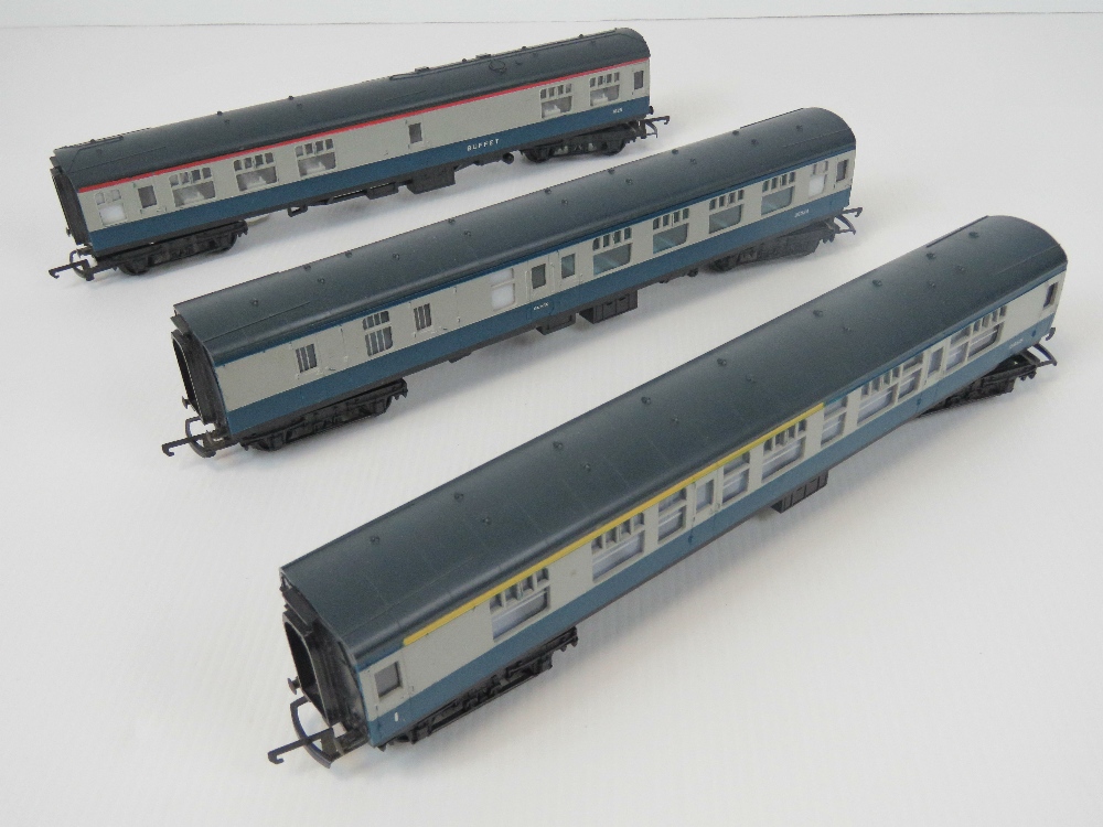 Three 00 gauge Triang passenger coaches in BR livery.