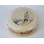 A bone trinket pot with seaside scene up