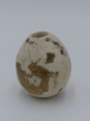 A PRE DYNASTIC EGYPTIAN CARVED BRECCIA MARBLE PIRIFORM MACE HEAD 6.5 CM TALL