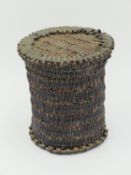 AN ANTIQUE SMALL LIDDED BASKET AND COVER WOVEN ENTRIELY FROM CLOVES 10.5 CM TALL