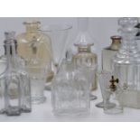 A GROUP OF EARLY 19TH CENTURY AND LATER CUT AND ETCHED GLASS DECANTERS, VASES AND OTHER VARIOUS