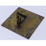 AN ENGLISH BRASS SUNDIAL, BEARS DATE 1687 WITH ROMAN NUMERAL CHAPTER AND LEAF ENGRAVED CENTER, THE