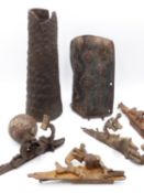 AN EASTERN LEATHER AND IRON SECTION OF ARMOUR, AN AFRICAN HIDE FOREARM ARMOUR, FOUR EARLY IRON