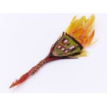 A SMALL FEATHER SOUTH AMERICAN PIN OR DECORATION. 16CM.