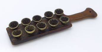 A 19TH CENTURY, FRUIT WOOD AND BRASS SUGAR OR CONFECTIONARY MOULD OF BAT FORM. 35CM LONG