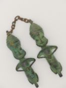 A PAIR OF BRONZE OGBANI YORUBA EDAN STAFF HEAD FIGURES UNITED BY A CHAIN. SOUTH WEST NIGERIA,