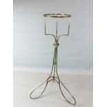 A SILVER PLATED WINE BUCKET/ ICE PAIL STAND ON SCROLL SUPPORTS 90 CM HIGH