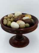 A COLLECTION OF ANTIQUE HEN BROODING EGGS TO INCLUDE TURNED WOOD AND PAINTED PHEASANT EGGS AND