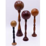 FOUR ANTIQUE TREEN BILBOQUET CUP AND BALL GAMES