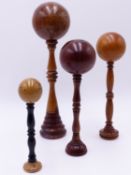 FOUR ANTIQUE TREEN BILBOQUET CUP AND BALL GAMES