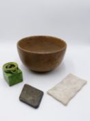 A RED STONEWARE DEEP BOWL, A GREEN GLAZED POTTERY OIL LAMP?, A SMALL WHITE MARBLE PALETTE AND A