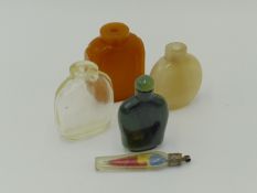 AN ORIENTAL CARVED DARK GREEN JADE SNUFF BOTTLE WITH STOPPER, A CHALCEDONY EXAMPLE, AN AGATE EXAMPLE