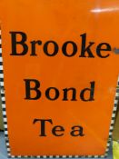 A BROOKE BOND TEA ENAMEL ADVERTISING SIGN AND RAILWAY LEFT LUGGAGE ENAMEL SIGN. LARGEST 51 X 76 CM