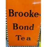 A BROOKE BOND TEA ENAMEL ADVERTISING SIGN AND RAILWAY LEFT LUGGAGE ENAMEL SIGN. LARGEST 51 X 76 CM