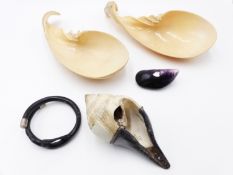 TWO LARGE WORKED CONCH SHELL SPPONS OR LADLES, A POLISHED MUSCLE SHELL WITH INLAY, A BLACK CORAL