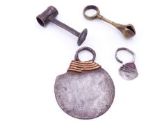 AN AFRICAN NGIGLIO FINGER KNIFE-KENYA, AN ASHANTI BRASS BELL PENDANT AND A NIGERIAN TIV SNUFF