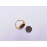 A ROMAN GOLD RING TOGETHER WITH A LATER ASSOCIATED GLASS INTAGLIO.