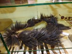 A TRIBAL OSTRICH FEATHER DECORATION. POSSIBLY ZULU.