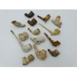 A COLLECTION OF ENGLISH AND EUROPEAN CLAY PIPES AND PIPE BOWLS.