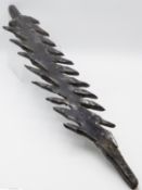 A LARGE WROUGHT IRON ARTIFACT WITH DEEP CUT SERRATED EDGES - POSSIBLY WEST AFRICAN CURRENCY 68 CM