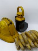 A VINTAGE SHOP DISPLAY BUNCH OF BANANAS, A FIREMAN'S HELMET AND A VINTAGE RAILWAY SIGNALMAN'S LAMP.