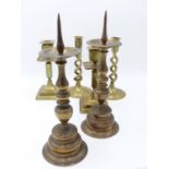 A PAIR OF 18TH CENTURY BRASS PRICKET CANDLESTICKS WITH BROAD DRIP PANS TOGETHER WITH TWO LATER