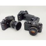 A NIKON FM 35MM SLR CAMERA S.No FM3327569, FITTED WITH NIKON SERIES E 50MM LENS TOGETHER WITH A