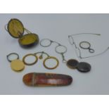 A PAIR OF ORIENTAL FOLDING SPECTACLES OR PINZ NEZ CONTAINED IN ORIGINAL LEATHER BOUND CASE