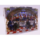 AN ANTIQUE REVERSE PAINTED GLASS PANEL DEPICTION OF THE LAST SUPPER. 26 CM WIDE