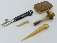 A 19TH CENTURY CARVED ANTLER AND SILVER MOUNTED PIPE TAMPER AND IVORY TAMPER IN THE FORM OF A LEG