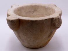A LARGE WHITE MARBLE MORTAR WITH FOUR CARVED LUGS. 19TH CENTURY 34 CM WIDE