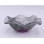 A ORIENTAL CARVED ROCK CRYSTAL BOWL WITH CLEAR, GREEN AND PINK HUE. DEEP SHAPED WAVY EDGE. 10 CM