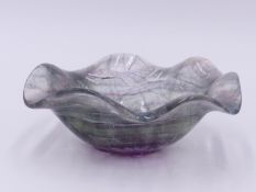 A ORIENTAL CARVED ROCK CRYSTAL BOWL WITH CLEAR, GREEN AND PINK HUE. DEEP SHAPED WAVY EDGE. 10 CM