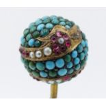 A 19TH CENTURY HAT PIN, THE BALL FORM TOP INSET WITH TURQUISE AND DECORATED WITH ENCIRCLING GOLD